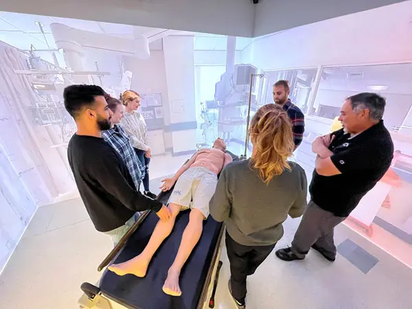 students standing New England’s only state-of-the-art Immersion Suite at the University of Maine at Fort Kent