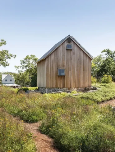 Susan Leahy's timber-frame barn with possibly the world’s most attractive outhouse.