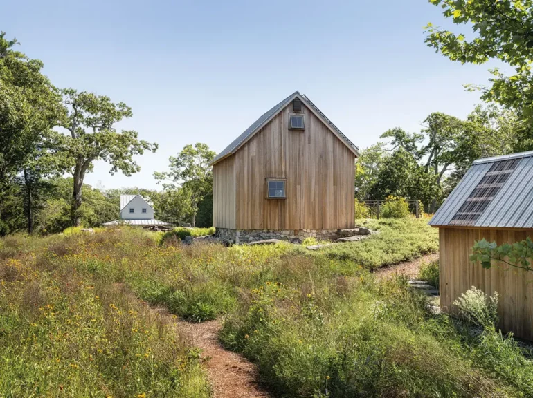 Susan Leahy's timber-frame barn with possibly the world’s most attractive outhouse.
