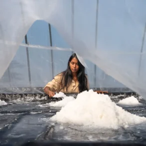 Usha Beaudoin collecting salt crystals at Matinicus Salt Farm